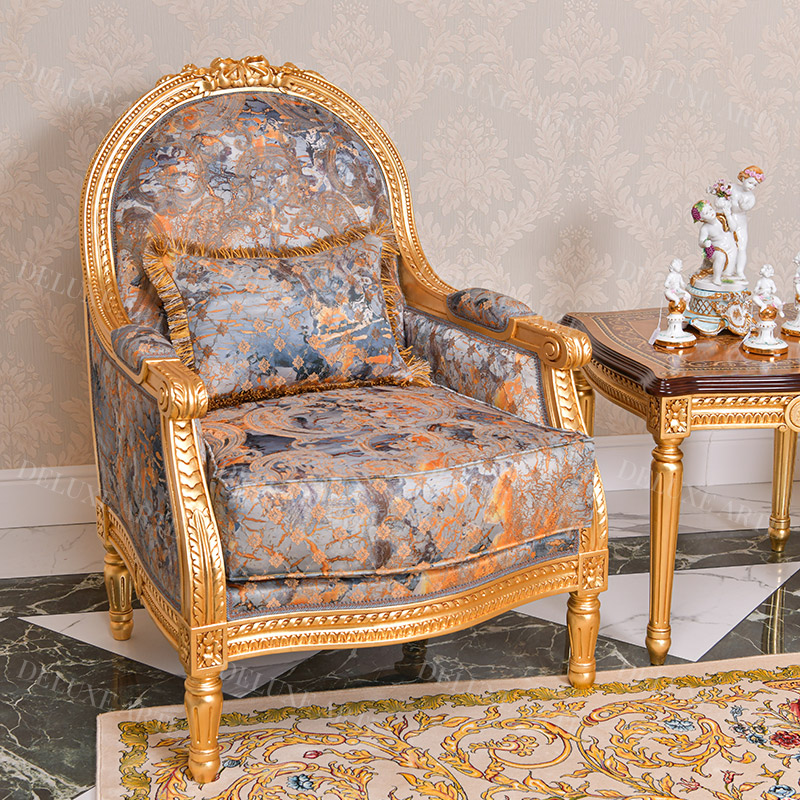 A classic vintage design armchair in Gold color finishing